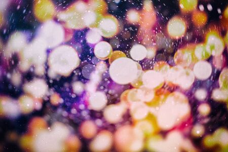 Festive background with natural bokeh and bright golden lights. Vintage magic background with colorful bokeh. Spring summer Christmas new year disco party background.の写真素材