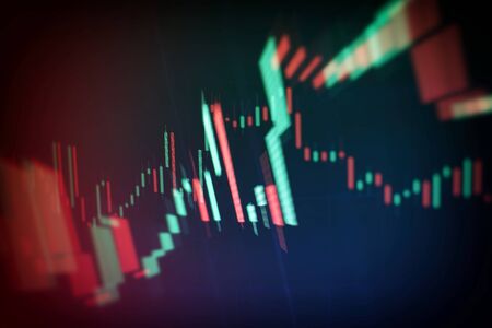 Abstract financial trading graphs on monitor. Background with currency bars and candles
