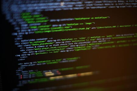 Website codes on computer monitor. Programmer workplace. Abstract screen of software. Computer...