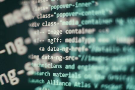 Website codes on computer monitor. Programmer workplace. Abstract screen of software. Computer program.の写真素材
