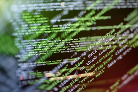 Website codes on computer monitor. Programmer workplace. Abstract screen of software. Computer...