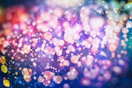 Abstract glitter lights and stars. Festive blue and white color sparkling vintage background . Blurred bokeh christmas background with snowflakesの写真素材
