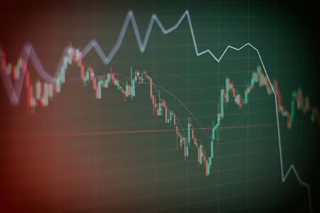 Abstract financial trading graphs on monitor. Background with currency bars and candles