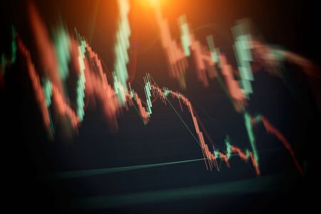 Businessman hand working on analyzing investment charts for Gold market, Forex market and Trading market.の写真素材