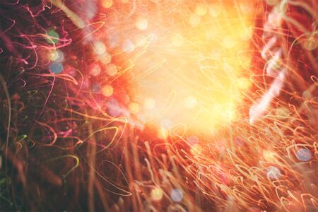Magic Background With Color Festive background with natural bokeh and bright golden lights. Vintage...