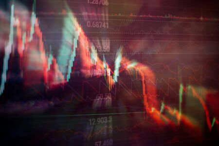 financial candlestick chart with line graph and stock numbers on gradient blue color backgroundの写真素材