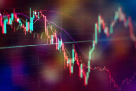 Abstract financial trading graphs on monitor. Background with currency bars and candles