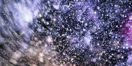 Cosmic pattern with soft blur on dark background, suitable for desktop wallpaper or for creative graphic design.の写真素材