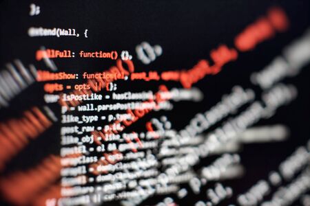 Modern tech. PHP syntax highlighted. Writing programming functions on laptop. Big data and Internet...