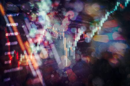 Technical price graph and indicator, red and green candlestick chart on blue theme screen, market volatility, up and down trend. Stock trading, crypto currency background.の写真素材