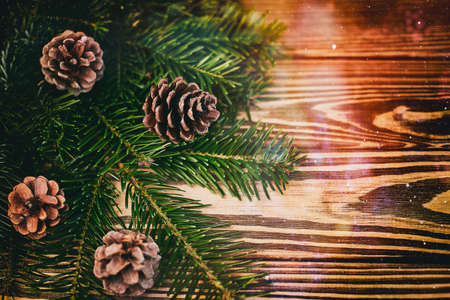 Christmas background, shishbka on a wooden board with a beautiful backgroundの写真素材