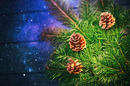 Christmas background, shishbka on a wooden board with a beautiful backgroundの写真素材