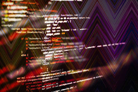 HTML5 in editor for website development. Website HTML Code on the Laptop Display Closeup Photo....
