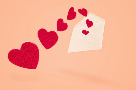 White envelope with flying out hearts, valentine holiday concept
