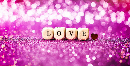 Lettering Love bright glitter lights bokeh background.の写真素材