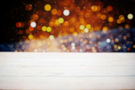 Wooden board empty table in front of blurred background. Perspective brown wood over blurt - can be used for display or montage your products.の写真素材