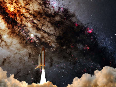 Rockets launch into space on the starry sky. Rocket starts into space concept.の写真素材