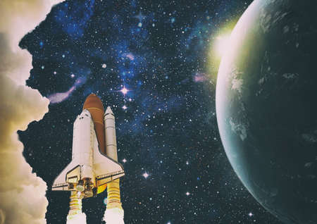 Rockets launch into space on the starry sky. Rocket starts into space concept.の写真素材