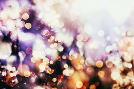 natural bokeh and bright golden lights. Vintage Magic background with colorful bokeh. Spring Summer Christmas New Year disco partyの写真素材