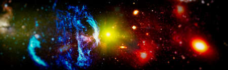 Nebula night starry sky in rainbow colors. Multicolor outer space. Star field and nebula in deep space many light years far from planet Earth.の写真素材