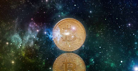 Bitcoin chart on-screen among piles of Bitcoins. Bitcoin trading concept.の写真素材