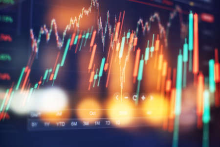 New modern computer and business strategy as concept. Financial diagram with candlestick chart used...