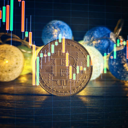 Investment platform with charts and bitcoin coin. Bitcoin BTC Cryptocurrency Coins. Stock Market Concept.の写真素材