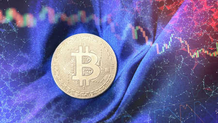 Gold bitcoins with Candle stick graph chart and digital background. Golden coin with icon letter B....