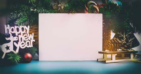 Wooden table decorated with Christmas gifts. Background with copy space mockup. Merry Christmas and happy new year.の写真素材