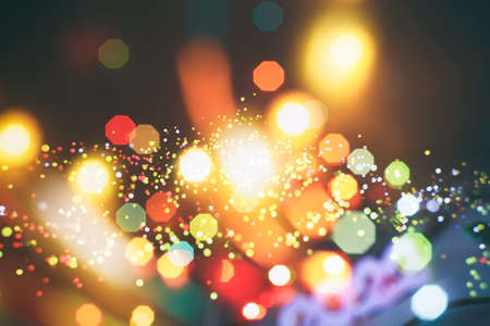 Abstract light celebration background with defocused golden lights for Christmas, New Year, Holiday, partyの写真素材