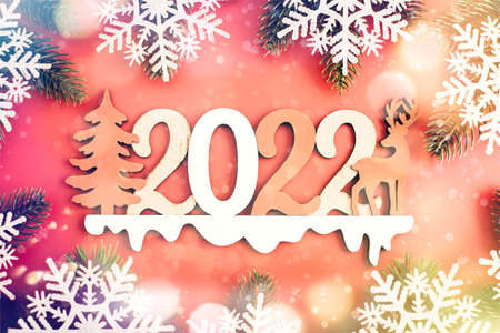Red Christmas holidays background; greeting card, Christmas card with fir and decor on glitter backgroundの写真素材