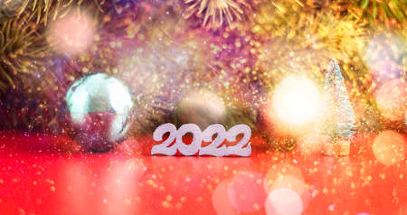 Red Christmas holidays background; greeting card, Christmas card with fir and decor on glitter backgroundの写真素材