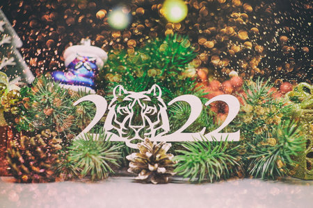 Holiday time. Happy New Year. Space for text.Christmas composition. Frame made of pine branches, fir cones on rustic vintage wooden background.の写真素材