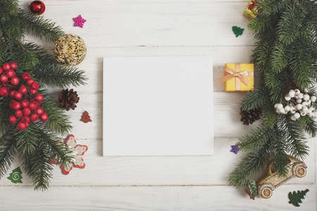 Festive Christmas greeting card with decorated fir tree and copy space for your xmas greetings. Top view flat layの写真素材