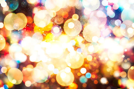 Blurry Christmas lights festive background. Christmas and New Year feast bokeh background with...