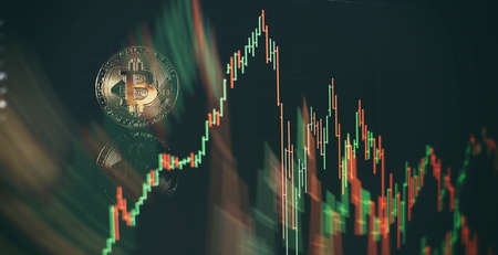 Chart shows a strong increase in the price of bitcoin. Investing in virtual assets. Investment platform with charts and bitcoin coin.の写真素材