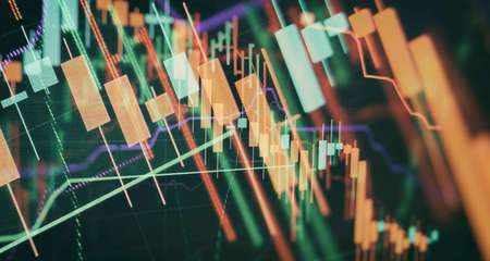 Businessman hand working on analyzing investment charts for Gold market, Market and Trading market.