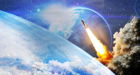 Rockets launch into space on the starry sky. Rocket starts into space concept.Elements of this image...