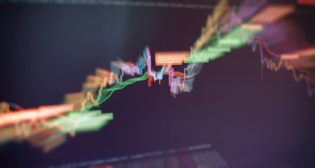 Charts of financial instruments with various types of indicators including volume analysis for professional technical analysis on the monitor of a computer.の素材 [FY310181868502]