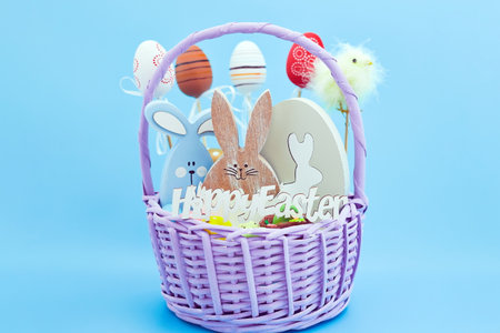 whiteeggs in the nest and yellow chicks on a blue background. An Easter card with a copy of the...