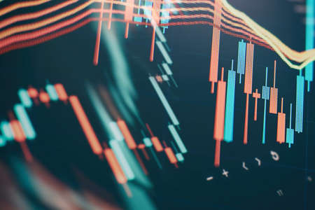 Businessman hand working on analyzing investment charts for Gold market, Forex market and Trading...