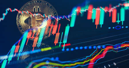 Virtual cryptocurrency concept. Bitcoin cryptocurrency with colorfull blurred candlestick chart in...