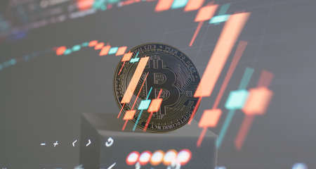 Trends in bitcoin exchange rates. Rise and fall charts of bitcoin. Bitcoins and New Virtual money concept.Gold bitcoins with Candle stick graph chartの写真素材