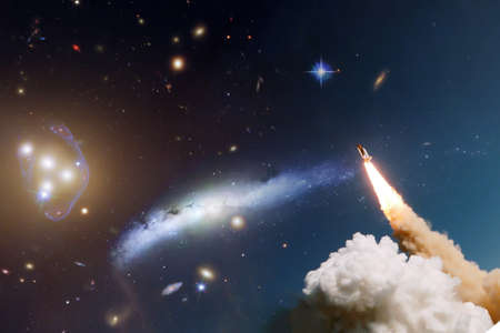 Rockets launch into space on the starry sky. Rocket starts into space concept.