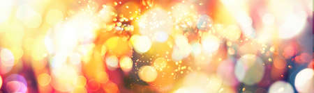 light color blur bokeh for background, abstract background. Bokeh light, shimmering blur lights on red.Cosmic explosion.Abstract blurred background in red-brown tones.の写真素材