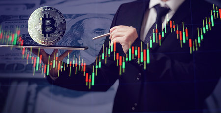 Cryptocurrency and investment. Businessman using tablet to connected on global network and gold bitcoin coin and growth of business graph, Financial, Stock market,の写真素材