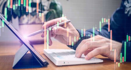 Businessman using computer laptop for trading forex exchange and money transfer by use technology...