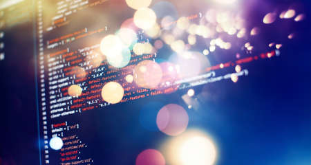 Security code on a computer display, close up. Database bits access stream visualization. Php language and coding function developerの写真素材
