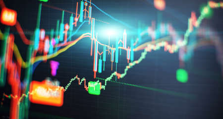 Concept of stock market and fintech. Blurry digital charts over dark blue background.