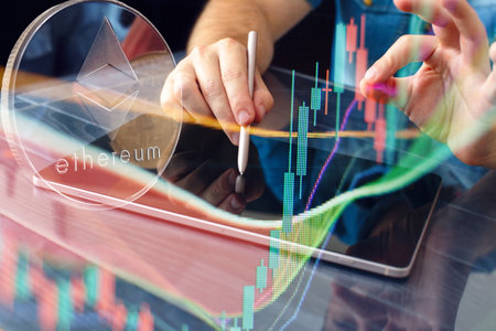 Businessman trades Gold bitcoins with Candle stick graph chart and digital background.Golden coin with icon letter B.Mining or blockchain technologyの写真素材